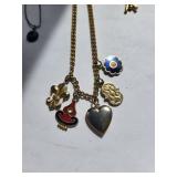 Collection of 10 Gold Tone Costume Jewelry Necklaces with Charms