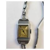 2 Vintage Watches: LGN Silver Tone Wristwatch & Gold Tone Bow Pendant Watch