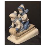 Children on a Sled Porcelain Figurine by Paul Sebastian