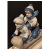 Children on a Sled Porcelain Figurine by Paul Sebastian