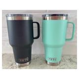 Pair of YETI Rambler 20 oz Mugs with Lids - Black and Seafoam