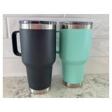 Pair of YETI Rambler 20 oz Mugs with Lids - Black and Seafoam