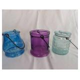 Collection of Colored Glass Vessels and Brass Candle Holders
