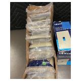 Box of 10 Leviton Ivory Nylon Midway Wallplates and box of Plastic wallplates. Box of 10 Leviton Ivory Nylon Midway Wallplates and box of Plastic wallplates.