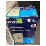 Box of 10 Leviton Ivory Nylon Midway Wallplates and box of Plastic wallplates. Box of 10 Leviton Ivory Nylon Midway Wallplates and box of Plastic wallplates.
