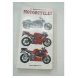 Sanyo Walkman, Sharp Wind-Up Alarm Clock, Garmin, Straps, Dorcy Light, Motorcycle Book