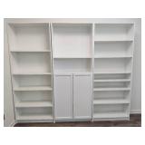 Three White Adjustable Shelving Units