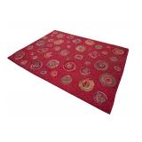 Red Area Rug with Circular Pattern