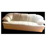Large White Leather Three-Seat Sofa with Padded Armrests