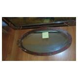 Vintage Oval Mirror as seen and Religious Picture with a Very Usual Frame Design