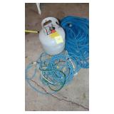 2- Blue Hoses, Electrical Cords and Almost Full Propane Tank.