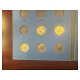 Three 90% Silver and Ten Clad Washington Quarters in Whitman Book