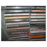 Wire metal CD tower stocked with mu...