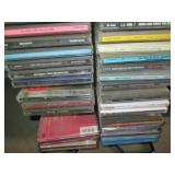 Wire metal CD tower stocked with mu...