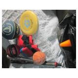 Garbage bag with assorted sporting ...