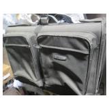 Dakota suitcase stuffed with men