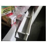 Unused utility sink full of plumbin...