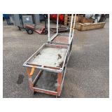 (2) rolling carts: Orange Rubbermaid commercial and Rubbermaid service cart with metal stand on top