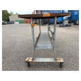 Metal rolling work table 72 ¼” l x 30” w x 38 ½” t