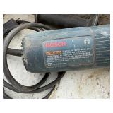 (2) Bosch corded angle grinders in carrying case. Powers up.