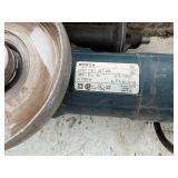 (2) Bosch corded angle grinders in carrying case. Powers up.