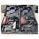 2 Powers Trak-It Gas Fastening tool in cases; battery in one case has a charge. Both fasteners power up
