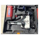 2 Powers Trak-It Gas Fastening tool in cases; battery in one case has a charge. Both fasteners power up