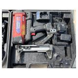 2 Powers Trak-It Gas Fastening tool in cases; battery in one case has a charge. Both fasteners power up