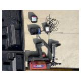 2 Powers Trak-It Gas Fastening tool in cases; battery in one case has a charge. Both fasteners power up