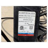 2 Powers Trak-It Gas Fastening tool in cases; battery in one case has a charge. Both fasteners power up