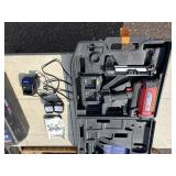 2 Powers Trak-It Gas Fastening tool in cases; battery in one case has a charge. Both fasteners power up