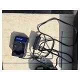 2 Powers Trak-It Gas Fastening tool in cases; battery in one case has a charge. Both fasteners power up