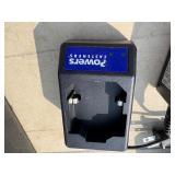 2 Powers Trak-It Gas Fastening tool in cases; battery in one case has a charge. Both fasteners power up