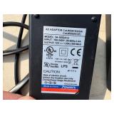 2 Powers Trak-It Gas Fastening tool in cases; battery in one case has a charge. Both fasteners power up