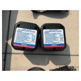 2 Powers Trak-It Gas Fastening tool in cases; battery in one case has a charge. Both fasteners power up