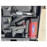 2 Powers Trak-It Gas Fastening tool in cases; battery in one case has a charge. Both fasteners power up