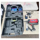 (2) Powers Trak-It C3 Gas Fastening tool in cases; Battery and charger Both power up