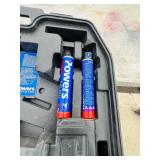 (2) Powers Trak-It C3 Gas Fastening tool in cases; Battery and charger Both power up