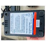 (2) Powers Trak-It C3 Gas Fastening tool in cases; Battery and charger Both power up