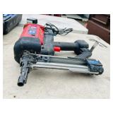 (2) Powers Trak-It C3 Gas Fastening tool in cases; Battery and charger Both power up