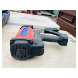 (2) Powers Trak-It C3 Gas Fastening tool in cases; Battery and charger Both power up