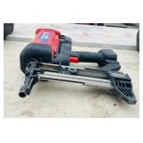 (2) Powers Trak-It C3 Gas Fastening tool in cases; Battery and charger Both power up