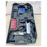 (2) Powers Trak-It C3 Gas Fastening tool in cases; Battery and charger Both power up