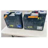 (2) Powers Trak-It C3 Gas Fastening tool in cases; Battery and charger Both power up