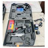 (2) Powers Trak-It C3 Gas Fastening tool in cases; Battery and charger Both power up