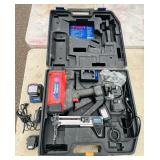 (2) Powers Trak-It C3 Gas Fastening tool in cases; Battery and charger Both power up
