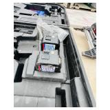 (2) Powers Trak-It C3 Gas Fastening tool in cases; Battery and charger Both power up