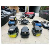 (2) Powers Trak-It C3 Gas Fastening tool in cases; Battery and charger Both power up