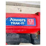 (2) Powers Trak-It C3 Gas Fastening tool in cases; Battery and charger Both power up