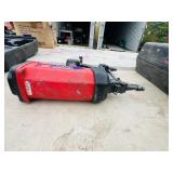 (2) Powers Trak-It C3 Gas Fastening tool in cases; Battery and charger Both power up